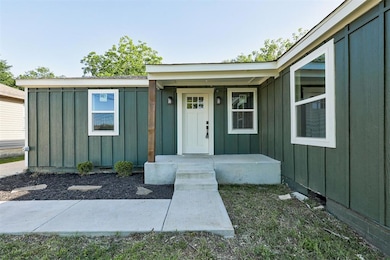 Property entrance with board and batten siding