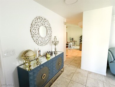 Hall with light tile patterned flooring
