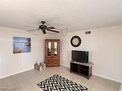 Unfurnished living room featuring baseboards, a ce
