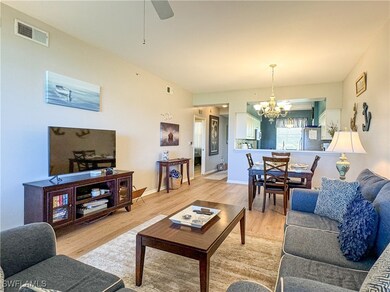 Living room with light wood-type flooring and ceil