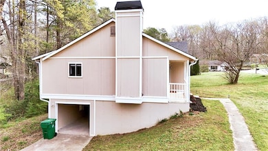 View of home's exterior with an attached garage an