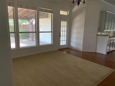 Spare room featuring dark wood-type flooring and a