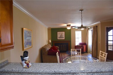 Open floorplan and granite counter with bar.  Note the front door and livingroom slider both lead to the cute front porch.
