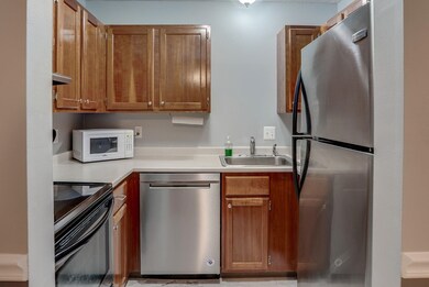 Full kitchen with SS appliances and new luxury vinyl flooring