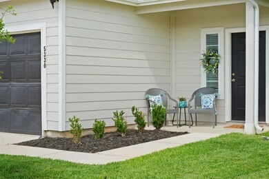 This charming front patio is a great place to conn