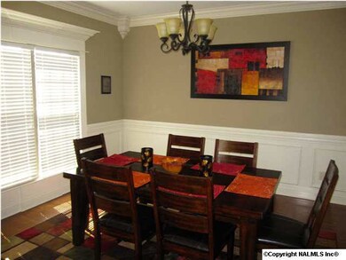 Serve those tremendous dinners in this SPECTACULAR Dining room loaded with massive crown molding, chair rail, wainscotting, HUGE 