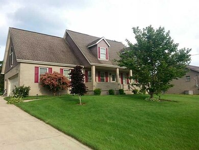 Exterior Front. Large Double-Wide Concrete Drivewa