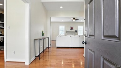 Corridor with light wood-style flooring and recess