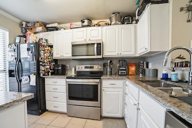 Kitchen featuring appliances with stainless steel