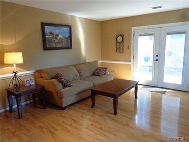 The 19' x 16' Family Room has fairly new custom la