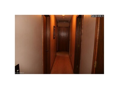 Hallway leads to bathroom & bedrooms