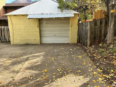 Detached garage with concrete driveway
