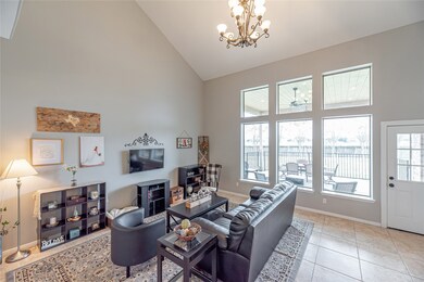 Whether you're visiting with friends or enjoying some family time, this space is perfect! Anchored by the beautiful wall of windows, this space is ready to entertain!