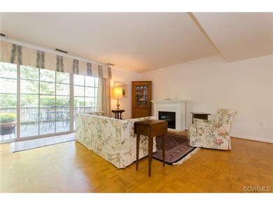 A triple sliding glass door opens to the rear slat