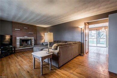 Living room with wood burning fireplace