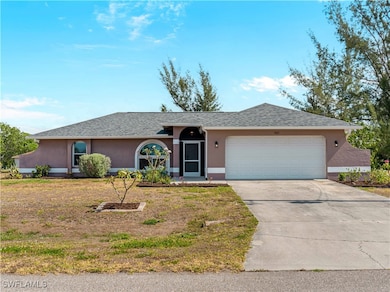 Single story home with concrete driveway, an attac