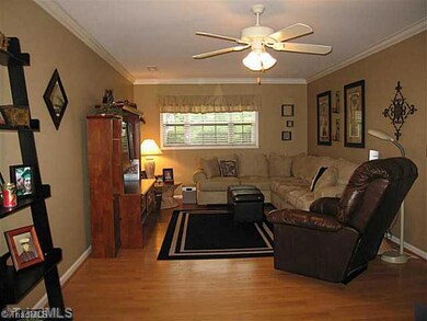 Den/Family/Great Room. The spacious great room offers beautiful neutral colors, hardwood floors, and a fireplace!  There is a full bathroom off the hall and an extra-spacious laundry room!