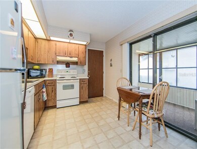KITCHEN FEATURES A BREAKFAST NOOK WITH GLASS SLIDE