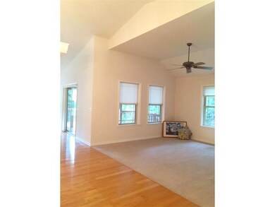 Living Room. PRIVATE CONVERSATION AREA THAT OVERLOOKS WOODED VIEW.