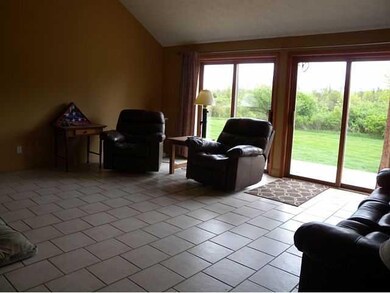 Living Room. The deck and large yard accessed from