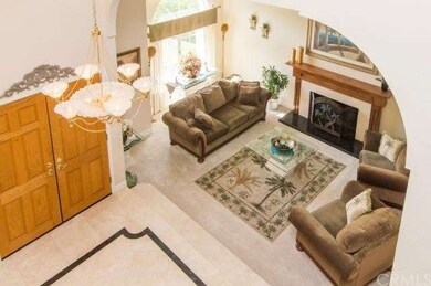 Luxurious foyer of travertine with a granite inlay