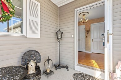 Vinyl siding and a nice cement front porch makes t
