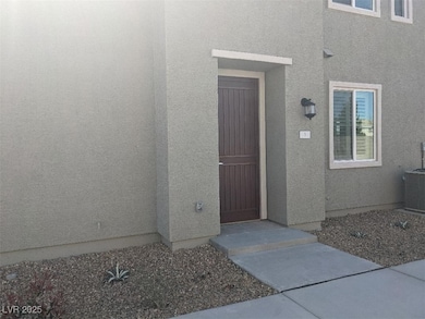 Property entrance featuring stucco siding