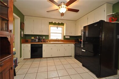 Large kitchen with butcher block counter tops.
