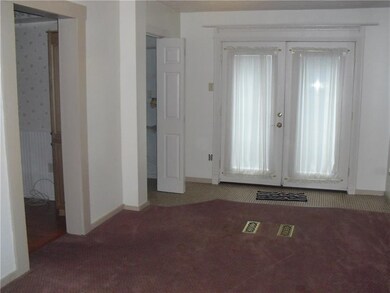 The dinning room with the French doors going out t