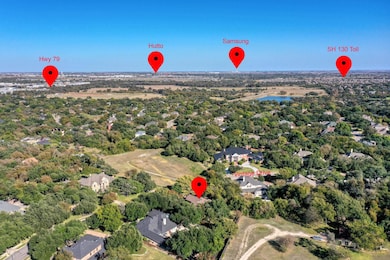 Aerial overview of property's location featuring nearby suburban area and a large body of water