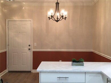 Dining room features chair railing and can accommo
