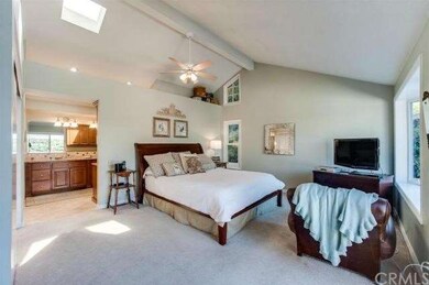 Master bedroom with vaulted ceilings.