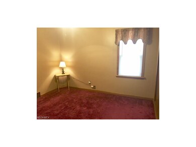 First Floor Master Bedroom has wine carpet, 2 newer Vinyl windows, Ceiling fan/light.