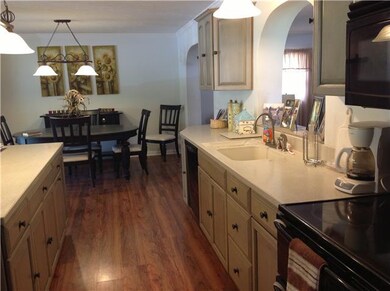 Looking from the other side of the kitchen. The kitchen also has an arched pass through that looks into the den. Love those country French cabinets. Very stylish and sleek.