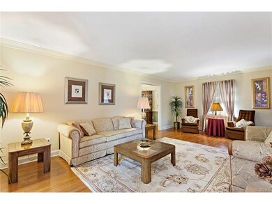 FORMAL LIVING ROOM WITH HARDWOOD FLOORS