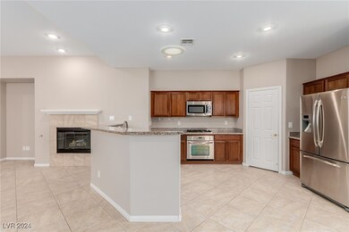 Kitchen with recessed lighting, visible vents, a t