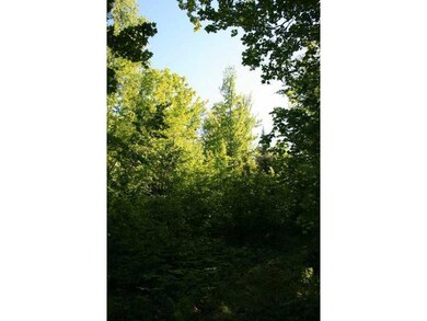 Land/Lot. A snowmobile trail borders...
