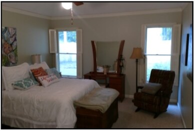 Large master bedroom with coffered ceiling