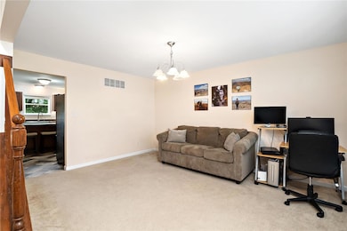 Living room to the right of the staircase.