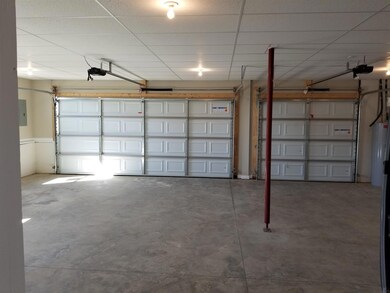 This 3 car garage has room for 3 full sized vehicles!