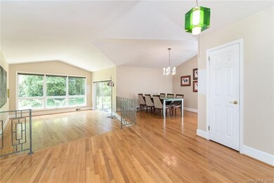 Welcoming foyer with living and dining room overlo