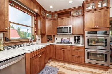 Kitchen with tiled countertops and backsplach, dou
