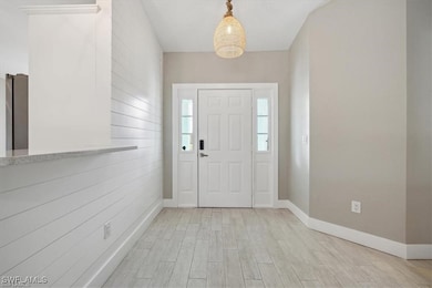 Entrance foyer featuring light wood-style floors a