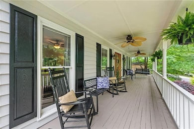 Front porch overlooking the large front yard and s