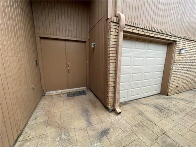 Double door front entry with additional garage door for storage or golf cart