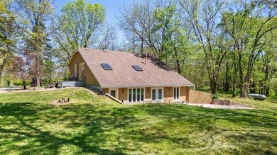 Rear view of house with a lawn