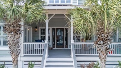 Doorway to property featuring covered porch