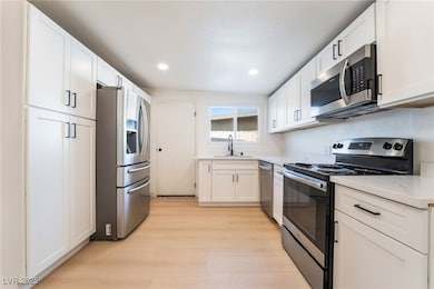 Kitchen with appliances with stainless steel finis