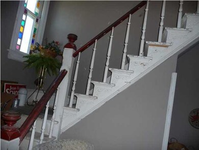 Grand entry staircase great you in the foyer.