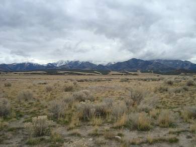 View of mountain background featuring rural landscape